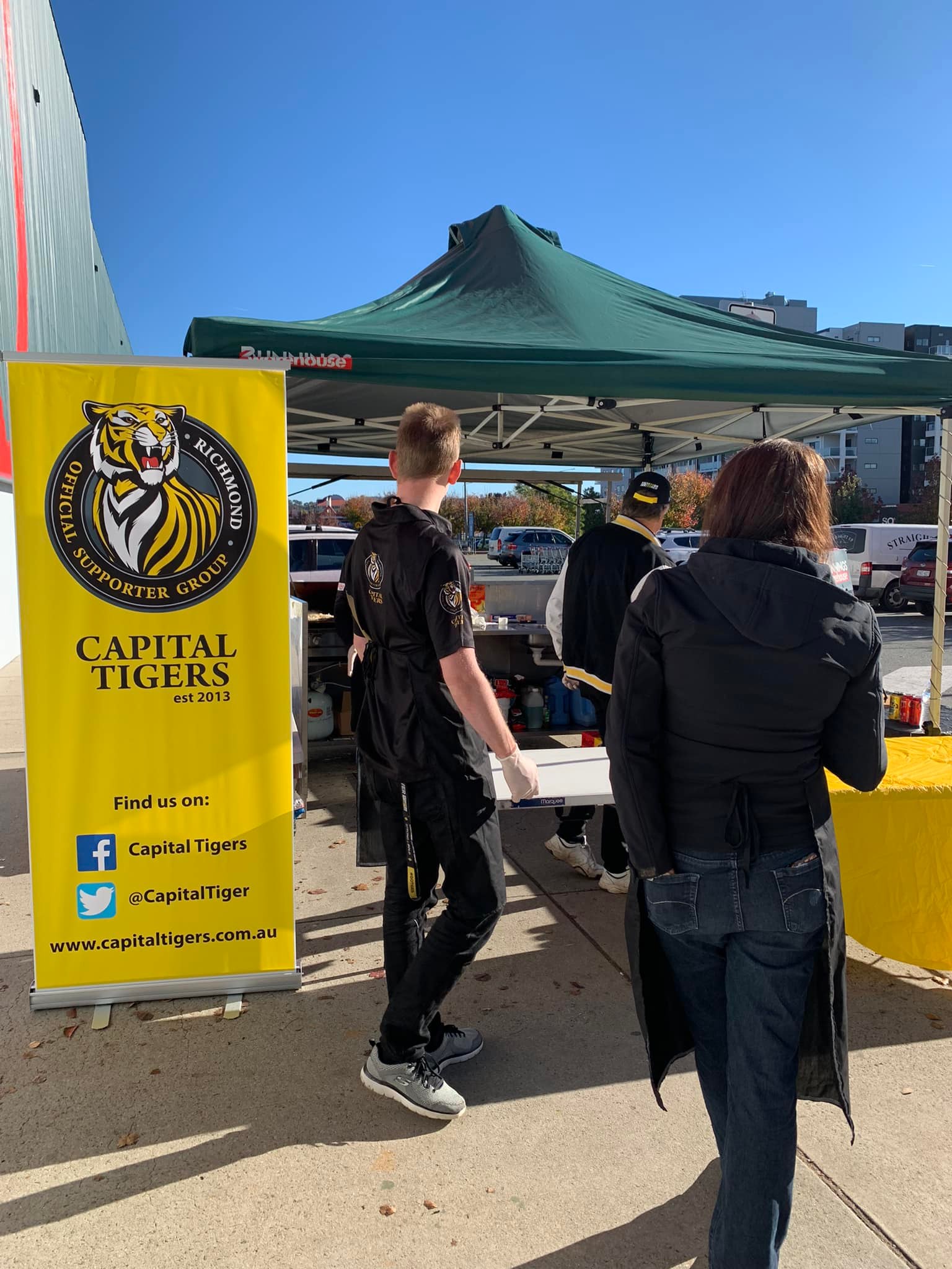 Club members volunteering at a Bunnings Sausage Sizzle